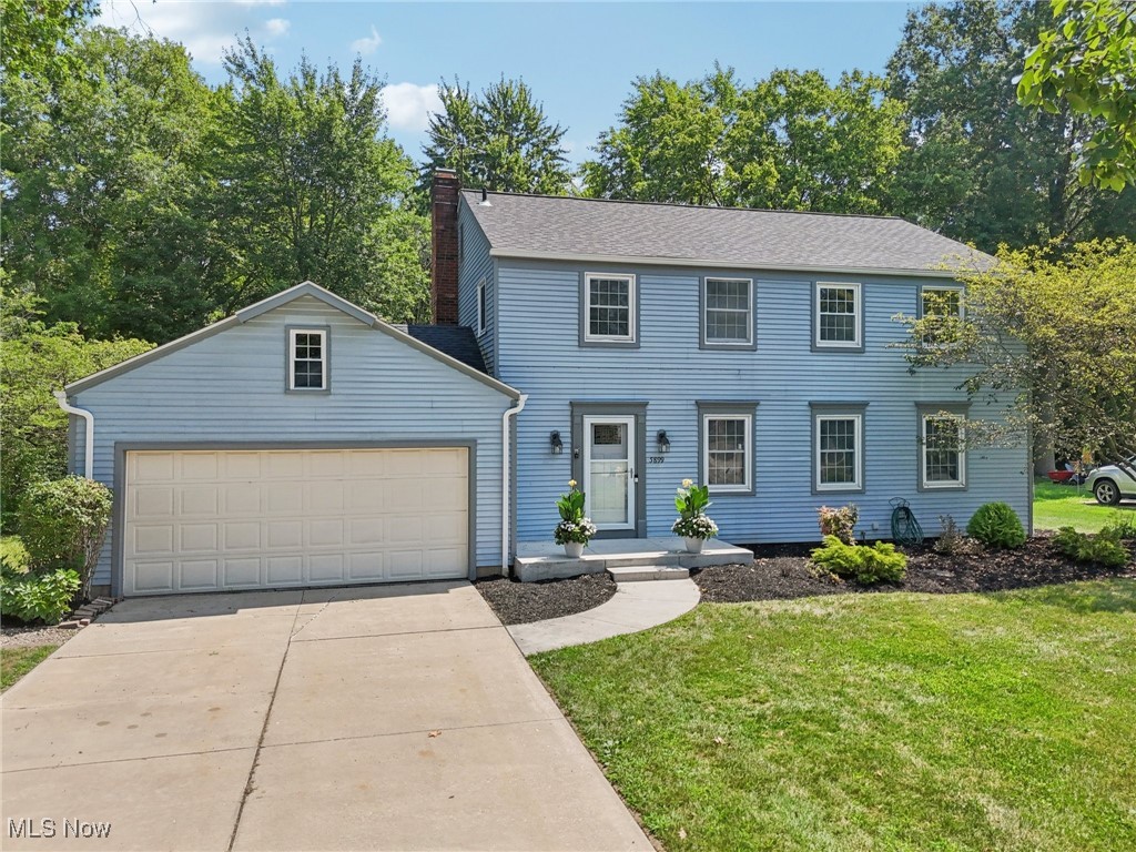 Beautifully updated Hudson home with custom finishes. This spacious and well-maintained home features a fully remodeled kitchen with granite countertops, custom cushion-close cabinetry, a center island with breakfast bar and striking blue cabinetry, subway tile backsplash, and a stylish combination of ambient ceiling lighting, under-cabinet lighting, recessed lights, and pendant fixtures. The spacious dining room flows seamlessly into a large living room—perfect for entertaining or everyday living. The cozy family room showcases a brick-surround wood-burning fireplace with a natural wood mantle, glass doors, and built-in bookcases—perfect for showcasing a book collection. Upstairs, you’ll find four bedrooms—three with brand-new carpet and the fourth featuring luxury vinyl plank flooring. The hall bathroom includes a beautifully tiled shower, granite countertop, and custom built-in cabinet, while the primary bathroom features a tiled shower, granite vanity, and thoughtful design that blends both function and style. Additional updates include a newer roof (2021), newer furnace, hot water heater, and newer luxury flooring throughout much of the main level. Located in a great neighborhood with close proximity to Colony Park and Barlow Farm Park, this home is move-in ready and full of warmth, comfort, and charm.