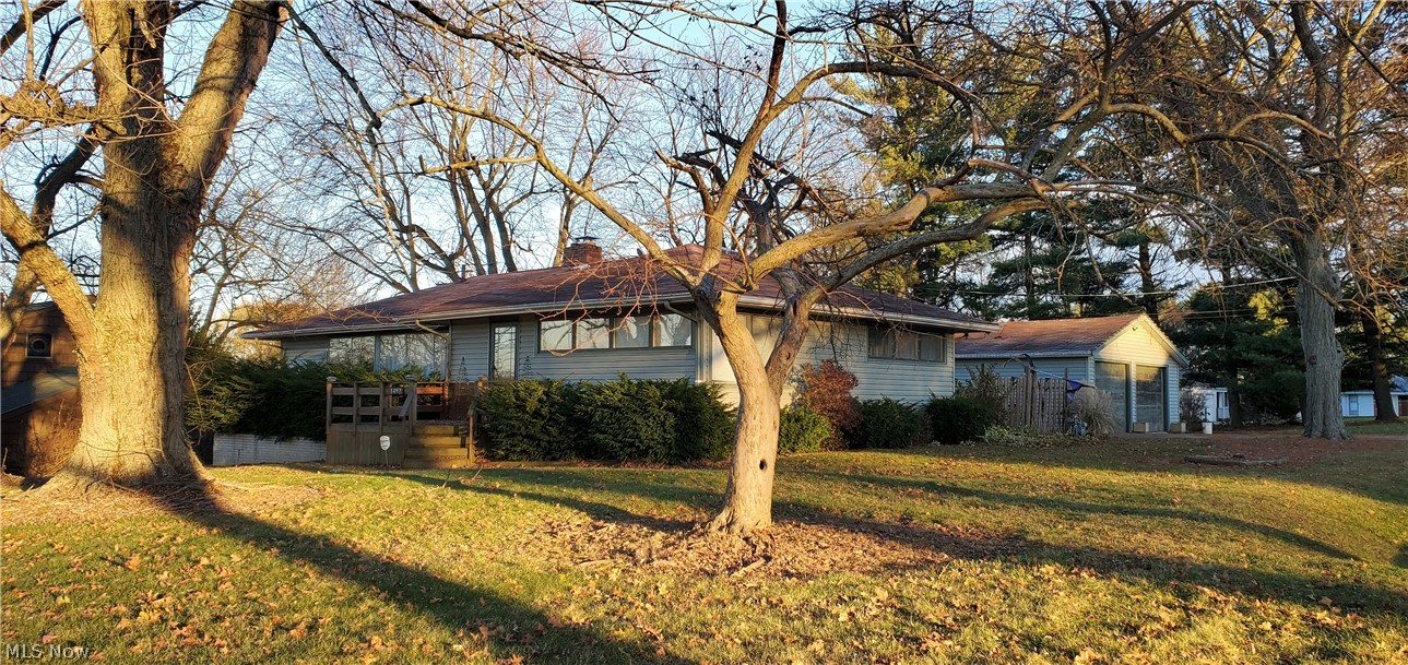Welcome to a classic mid century 3 bedroom 2 bath ranch on a 3/4 acre lot. The open floor plan lends itself to comfortable lifestyle living. The living room with fireplace has large windows that bring in light and views of farm land. The ample sized adjacent kitchen and formal dining area are perfect for family gatherings. The full walkout basement has a workshop and 377 square foot partially finished recreation room that can add additional living space. The exterior deck that is perfect for warm weather entertaining, leads to an oversized detached garage. For additional storage there is a shed that can accommodate lawn equipment too.
The home needs some updating, but has tons of potential and the convenience of first floor living. This home is being sold as is.