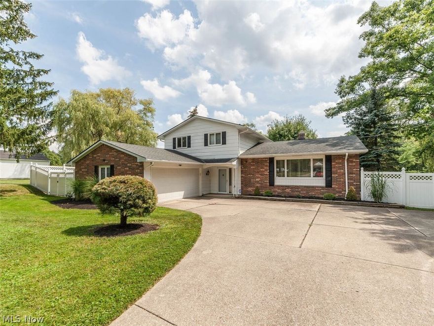 Sought after and rare 4 bedroom, 2 1/2 bath split level in Broadview Heights.  The house is situated on over 2/3 an acre and offers a nicely landscaped large front yard with plenty of guest driveway parking space.  There is a first floor bedroom, half bath and an abundance of living space in the large living, dining and family rooms.  The family room features a fireplace and sliders opening onto the enclosed patio  The upper level features a master bedroom with private bath and two other large bedrooms and a second full bath.  The completely private fenced-in backyard, with its parklike views, is perfect for entertaining and is accessed from the enclosed patio.