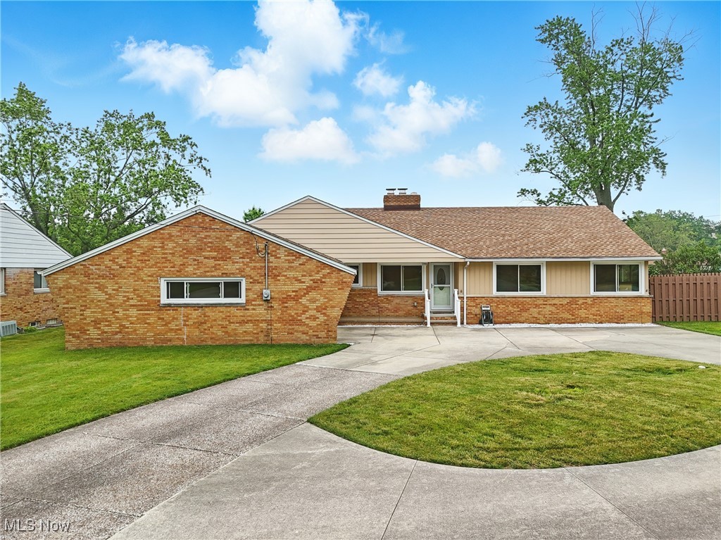 Welcome Home to this spectacular 3 Bedroom, 2 Full and 1 Half Bath Ranch on a peaceful street in Seven Hills. Beaming with curb appeal and a spacious circular driveway, enjoy all the perks of one-floor living! A concrete porch invites you into a convenient, updated eat-in kitchen with ample counter space & all stainless steel appliances (dishwasher & fridge less than 5 years old). Newer wood floors in the spacious living room with recently replaced (2023) picture window and slider with newer blinds that overlook the fully fenced backyard. A cozy, mantled fireplace offers extra charm. Master suite has large closet and recently renovated master bath with a zero entry shower, elevated toilet & newer fixtures/vanity. 2 additional bedrooms with good closet space share the updated hall full bath with elevated toilet & newer vanity/fixtures. Carpets in all bedrooms replaced 2020. A first floor laundry room/mudroom has access to the attached 2 car garage, an exit to the backyard & small patio and a half bath adds extra convenience to the first floor. The lower level rec space is huge! It offers dual a spaces to make your own for entertainment & storage plus glass block windows! Updates also include: roof 2020, wood privacy fence 2020, engineered wood floor 2020, most newer windows by Champion, garage door 2020, and sewer line improvement 2020, HVAC dehumidifier 2023, 2021 front storm door & railings. A superb location means minutes to all highways, shopping, & restaurants. A must see!