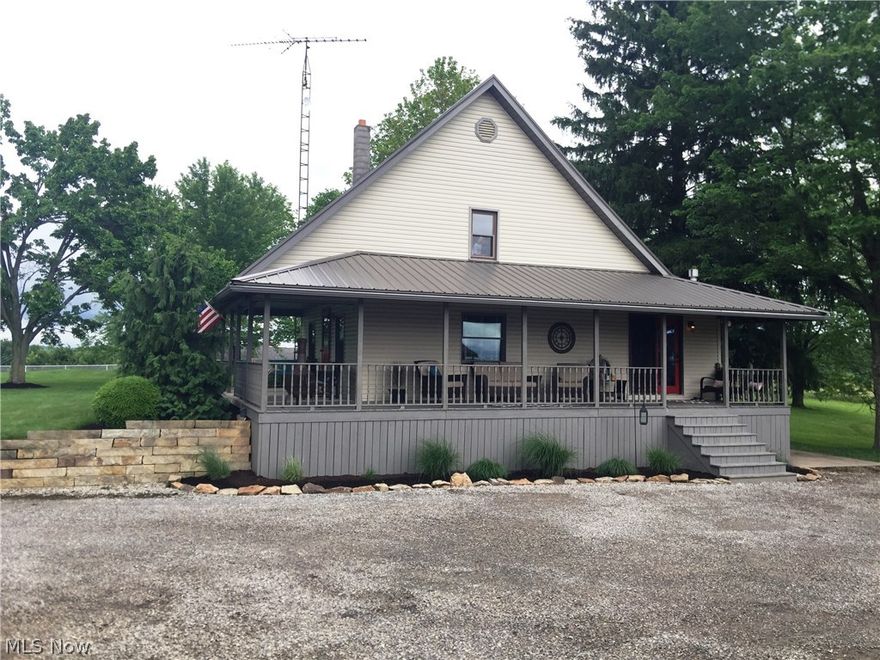Auction 6/27- Wonderful setting for this country offering of over 3.5 acres of gentle rolling land with mature trees and good privacy. The home features a cherry eat in kitchen equipped with appliances, large living room, bedroom and full bath on the main floor along with a large bedroom and full bath upstairs. Full basement has outside entry and laundry area, and utilities include city water, private septic, natural gas forced air heat, central air, newer gas hot water heater, and a wood burner. The home has a wraparound porch, beautiful wide trim woodworking throughout, newer steel roof, and is move-in ready. Additionally there is a 26’x40’ 3 bay brick garage with heat and separate hot water heater. The land is all usable with excellent areas for pasture and additional improvements if needed. This is a great opportunity for all home buyers and is in a very convenient location. Legal: Parcel #’s 6800241000, 6800242000, & 68-00772001 in Wayne Township of Tuscarawas County and the Garaw