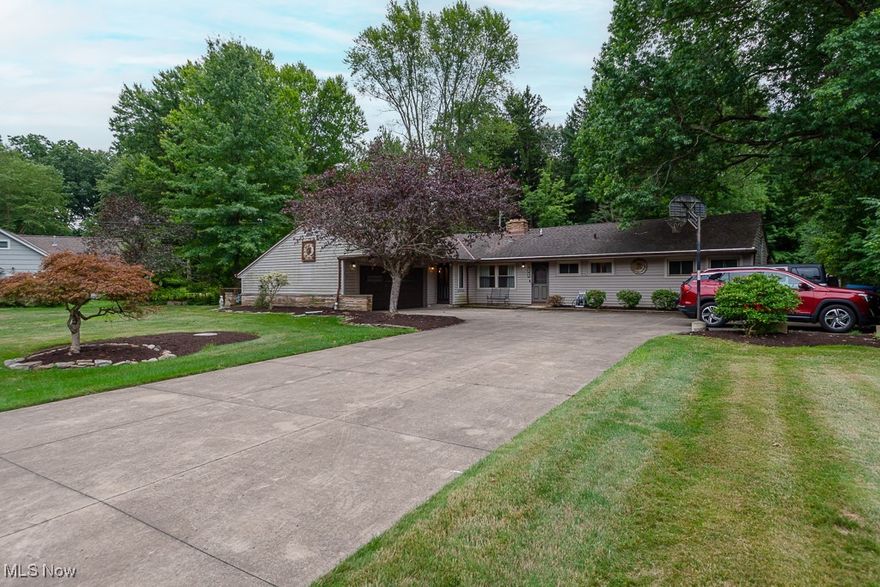 3 bedroom ranch in the soul of Olmsted Falls dubbed as the "Stable District", awaits your opportunity to own a home on a 1 acre lot with easy access to Metroparks, walking trails, and its historical downtown district.  Kitchen had a complete remodel in 2023 with beautiful soft close cabinets, granite countertops, stainless steel appliances, new backsplash, a brand new ceiling complete with recessed lighting. This charming home offers so much in natural sunlight with floor to ceiling windows in the great room, skylights, and even offering a cozy wood burning fireplace. If you love to surround yourself in sunlight and plants this home also features a 20 x10 garden studio off the great room. The office, discreetly tucked away for extra peace and quiet, is an extra bonus with brand new carpeting. 2 full bathrooms, 1 with walk-in shower and 2nd with jetted soaking tub. All 3 bedrooms have been freshly painted and off the main bedroom is an enclosed patio surrounded by sliding glass doors, crowned with skylights, perfect for enjoying a summer breeze without the summer bugs. H20 tank is 2022. All appliances stay including the freezer, as well as an air compressor, tractor, snowblower, and shelves in garden room. 1 year home warranty included!