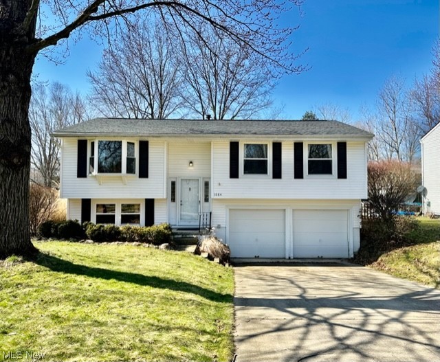 Welcome home! Dont miss this updated bi level in a wonderful residential community, conveniently located near everything Kent has to offer! Main floor boasts an open floor plan with a vaulted great room and modern neutral paint colors throughout. Kitchen remodeled in 2020 with stainless appliances, new flooring and new counters. Dining room has sliders out to the large back deck and fully fenced back yard. Spacious bedrooms with good closet space. Lower level family room and half bath plus laundry room. So many updates! Newer windows throughout, updated lighting in '21, new furnace in '22, gutter guards and roof sealed in '22, new garbage disposal in '22, bathroom tub, faucets and sink updated in '22-23. Priced to sell!
