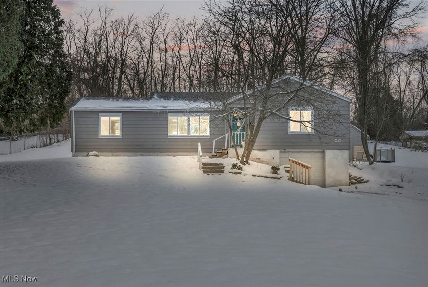 Say hello to this adorable ranch on a quiet street, offering 3 bedrooms, one bathroom and an attached garage. This farmhouse styled home sits on over half of an acre of land, in the highly desired Norton city school district. When you walk inside, you will immediately be welcomed and feel all of the cozy vibes this house has to offer, finished with fresh paint, and plenty of natural lighting throughout. The living room over looks the front yard, and will lead to an eat-in kitchen with a view into the back yard. This 0.52 acre lot can be suited for homesteading, gardening, and will give you that private, wooded-lot feel. Sellers installed new lighting and a ceiling fan in the entryway and living room, added a functional accent wall with coat hooks, all stainless steel appliances, and refinished the kitchen cabinets with new hardware and paint. Improvements also include freshly poured concrete in sections of the garage and basement, dry locked entire basement and garage, and waterproof concrete floor paint. HWT is 2022. We are excited for you to come see the home that these sellers have loved so much! Schedule a tour today.