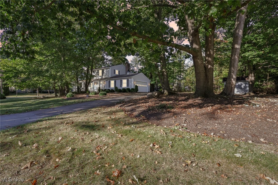 Discover this updated Colonial home just minutes from Hudson. Enjoy your morning coffee on the inviting covered front porch, listening to the gentle rustle of mature trees. Step inside to find stylish updates, including new flooring, fresh paint, and a fully remodeled kitchen. Relax in the spacious family room, where the warmth of the fireplace and the charm of built-in bookshelves create a welcoming atmosphere. Embrace the fall breeze on the expansive back deck made from durable Trex material, built to withstand the test of time. Upstairs, discover four bedrooms and two full bathrooms. Each bedroom offers generous closet space, with the Master bedroom boasting three closets. The full basement presents endless possibilities for your future projects or serves as ample storage space. Enjoy the convenience of being just moments away from Colony Park, a 34-acre neighborhood park featuring an open meadow with three ball fields for Little League and Youth baseball. Additional amenities include playground equipment, a basketball court, sand volleyball, a pavilion, and two trails, each approximately a quarter mile long. This home comes with a whole house generator too!