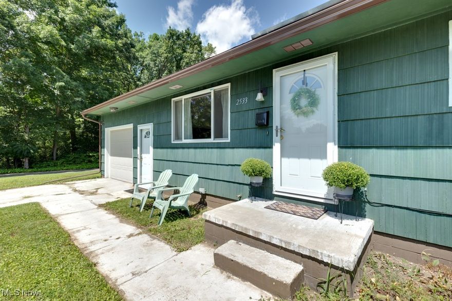 Looking to downsize or just starting out? Then this is the home for you! Tastefully updated, this ranch home has hardwood floors throughout, except for the kitchen and bathroom, which have Luxury vinyl tile. The spacious living room has great natural light streaming from the windows which were all updated in 2020. The kitchen has newer cabinets, a SS farmhouse sink and sleek black appliances, including a double oven. The bathroom has a cool, sliding barn door, plus newer cabinetry and fixtures. All the bedrooms have floor-to-ceiling double closets, maximizing storage space. The full, dry basement, half of which is finished, has glass block windows, new HVAC in 2020, and an updated electric panel in 2022. Venture outside to your private, fenced-in backyard—a perfect playground for pets, a great gardening opportunity, or your own serene escape. Plus, you’ll love the convenience of the attached garage, making parking and storage a breeze. For nature lovers and adventure seekers, the West Branch Trail State Park is practically in your backyard! With 4.5 miles of scenic hiking and biking trails, you’ll have endless opportunities for exploration and exercise right next door with your pet, a friend or all by yourself. Whether you're gearing up for a weekend hike or a leisurely bike ride, this home offers the perfect balance of comfort and convenience, with nature just a step away. Call your favorite Realtor today and come see it for yourself!