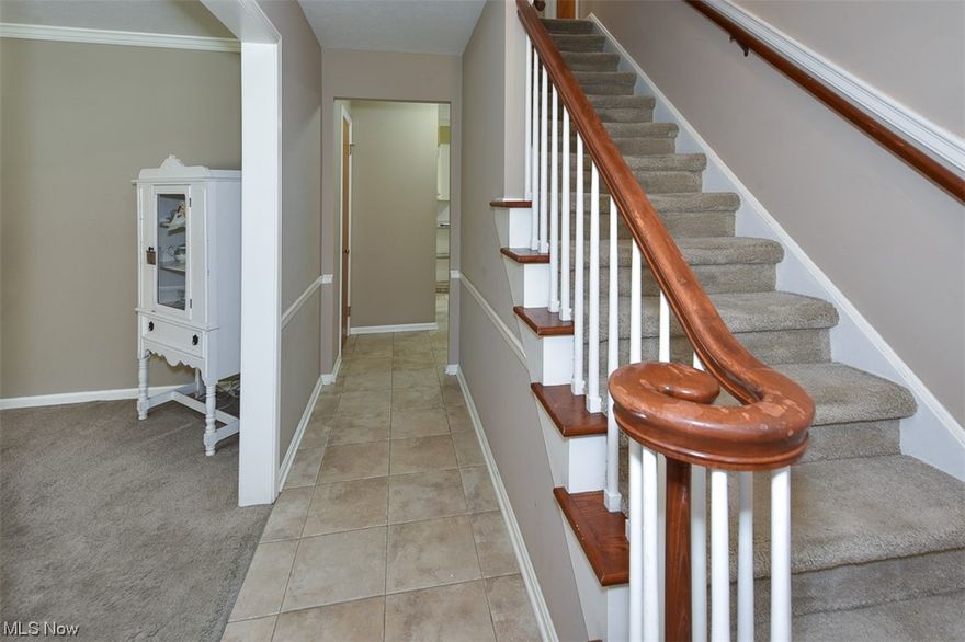 Welcome home to a classic colonial located in the sought after Northfield/Longbeach neighborhood nestled nearby the BAYarts/Huntington campus. This four bedroom 1.5 bath home welcomes you in with tidy landscaping and an inviting front porch leading to a ceramic tiled foyer traditional decorative staircase and spacious living and formal dining rooms with crown molding.  The light-filled eat-in kitchen features new classic subway tile and granite countertops.  A family room with a cozy woodburning fireplace and sliders to the backyard is a perfect space to make your own. Updated powder room on 1st floor provides additional convenience. Ample backyard is a private oasis with fire pit, newer concrete patio and/or additional room to grow the footprint of the home to meet your family’s evolving needs.  Four generously sized bedrooms on the second floor include a primary bedroom with dual walk-in closets for extra storage. Three bedrooms are complete with hardwood flooring.  A full bath upstairs has been completely remodeled with beautiful dual vanity and a standup shower/bathtub.  All appliances stay including washer/dryer in well maintained basement. Many exterior updates include a newer garage door, concrete drive and roof approx.(2012). Enjoy easy access to the beautiful park setting including running/walking trails, the Lake Erie Nature and Science Center, BAYarts, Chatty’s Pizza and Bay High. Make your appointment today-rare opportunity for this great neighborhood!