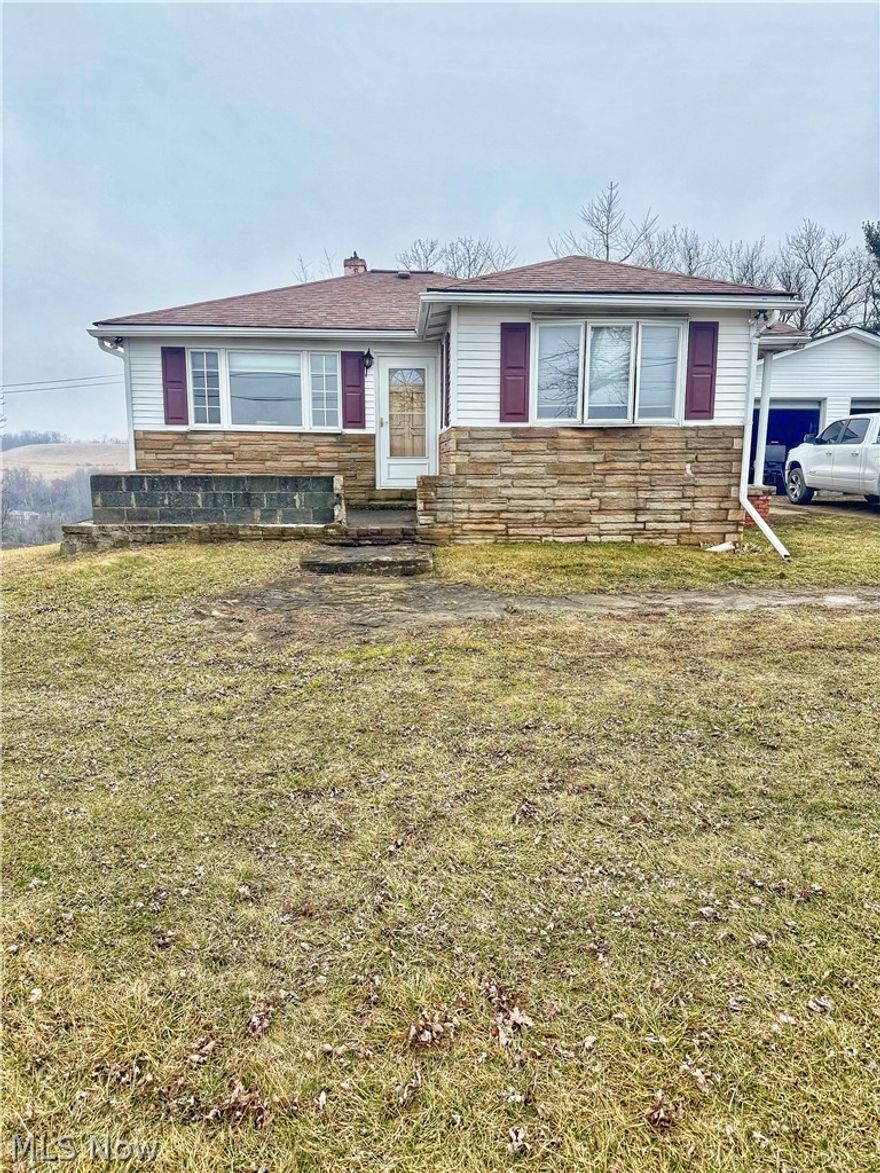 Move-in ready ranch home in a peaceful country setting. This 2 bedroom, 2 bath home features new flooring throughout and a comfortable layout with plenty of natural light. The full basement offers additional living or recreational space and includes a bar area along with a wood burner for supplemental heat. Recent updates include a new hot water tank, new well bladder tank, and updated well piping. Outside you'll find a large detached 2 car garage provides plenty of space for vehicles and includes a lower-level storage or workshop area underneath. Schedule your showing today!