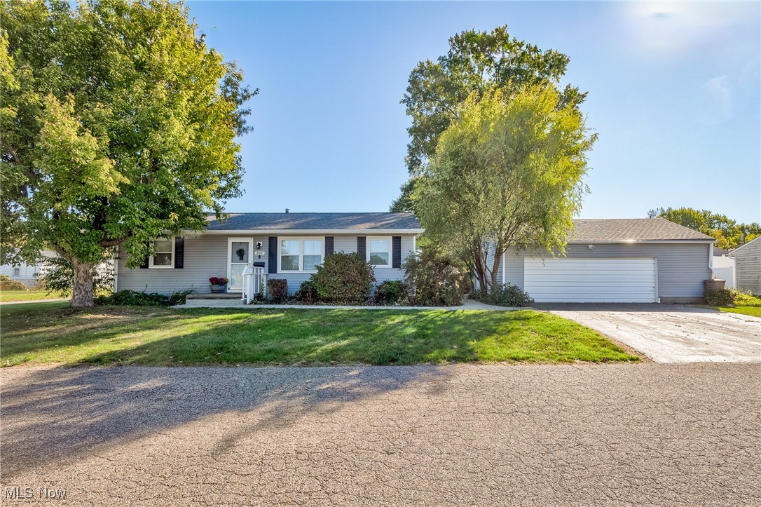 Welcome home to 207 28th St SW in Barberton! This charming ranch is filled with natural light and has been thoughtfully updated, making it truly move-in ready. With 3 bedrooms and 1 bathroom, this home offers a smart layout that combines comfort, convenience, and style. Step inside to find beautiful wood floors throughout much of the main level, along with updated flooring in both the kitchen and bathroom. The bright kitchen features a new stove (2023), hood vent (2023), and refrigerator (2023), plus a newer dishwasher and garbage disposal, making meal prep a breeze. The smaller bedroom provides the perfect option for main-floor laundry, in addition to the full laundry room in the basement. The lower level boasts glass block windows (2022) and tons of potential—whether you’re looking for storage, a workshop, or future living space. Outside, enjoy the large patio, 2-car garage, and gorgeous curb appeal enhanced by beautiful seasonal flowers that make the home shine. Major updates include: Roof (2019), Windows (2022), Furnace & A/C (2020), Stove & Hood Vent (2023), Refrigerator (2023). This property is agent-owned and truly move-in ready—just bring your belongings and start enjoying your new home! Assessment: Barb/Nort Mosquito Distribution ($19/year). Microwave, deep freezer, ring doorbell and cameras, washer and dryer do not convey. First Energy (Electric), Enbridge (Gas), and City of Barberton (Water, Sewer, Trash).