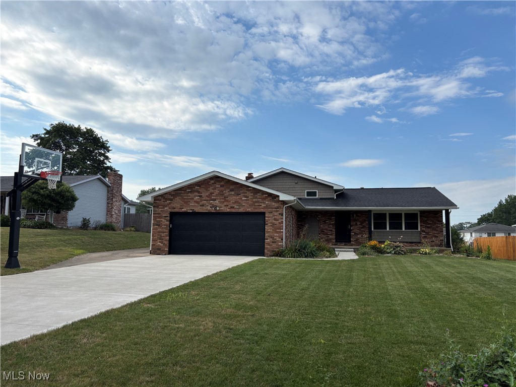 Welcome to this 3-possibly 4 bedroom home in a well desired Hartville neighborhood. Many updates to this home include: all new Pella Windows, new outside front, back and sliding door, new front storm door with titanium screens, siding, back patio, driveway and front sidewalk, glass block windows in the basement and garage, removed trees added topsoil and regraded backyard, Backyard privacy fence, and new tile in the master bathroom. Roof (2015), Downspouts cleaned & repaired (2018), Furnace and AC (2015), water softener (2016) garage door opener (2016). This home has not updated the kitchen and bathrooms.