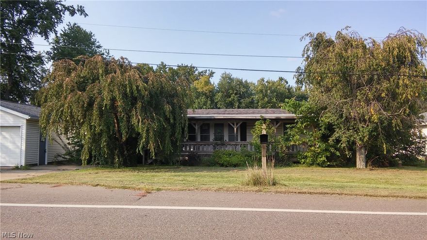 Riverfront property with newer oversized 2-car garage built in 2009. 3 bedroom, 2 bath modular needs work and does not have a septic.