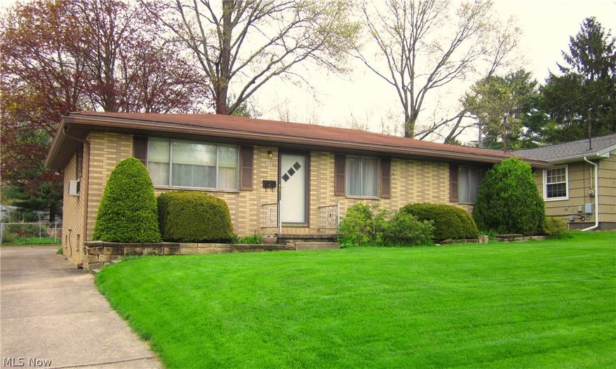 The Best of Mid Century Modern! This one owner brick ranch has 3 bedrooms, a full bath on the main floor and full bath facility on the lower level. There's a lower level family room, storage room and a large utility/furnace room area. Hardwood floors are under living room, dining room and bedrooms. This home has been well cared for and is in very good original condition. Back yard is fenced with tall trees and flower plantings. Convenient to shopping, schools and KSU.