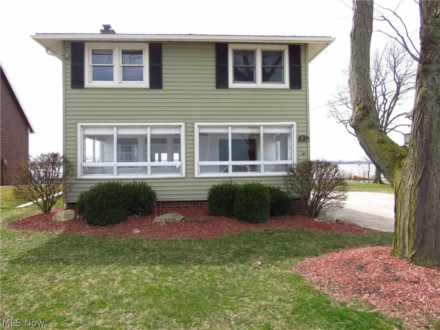 Be first or be sorry! Incredible Lake Erie to Sandusky Bay views! See the sunrise from your private beach in your front yard and sit on your concrete dock and watch the sunset from your back yard! Four bedroom, two full bathroom Colonial. Splash in yours or your friends boat, jet skis & kayaks from your 17 foot ramp. Big bedrooms! Walk-in closets. Awesome views of the water from every room. Second floor laundry room. Two tier deck overlooking the bay. About two miles to Cedar Point! Why drive when you can drop the kids off on a jet ski or boat! Walk over some gravel and rocks to your own private beach. Custom concrete & steel dock has bumpers, cleats, ship to shore power, fresh water & electricity. It is set up to add two Golden boat/jetski lifts so you can push a button & have your toys in or out of the water. Cedar Point Road is on track to get repaved and a three foot bike trail attached which means you can ride your bike for nearly five miles. Furnace, central air, electrical panel