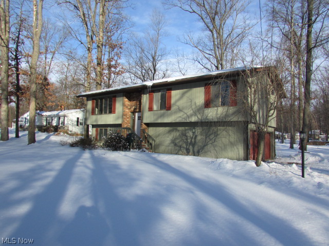 Three bedroom, two and one half bath bilevel on treed 3/4 acre lot. Vaulted living rm & formal dining . Foyer w/ceramic floor, skylight & beveled glass side lights. Eat-in oak kitchen w/ ceramic floor & slider to deck. Master w/updated master bath w/Corian sink & ceramic floor Family room w/crown molding, access to 1/2 bath, slider to brick patio & covered raised deck. Property sold AS IS.