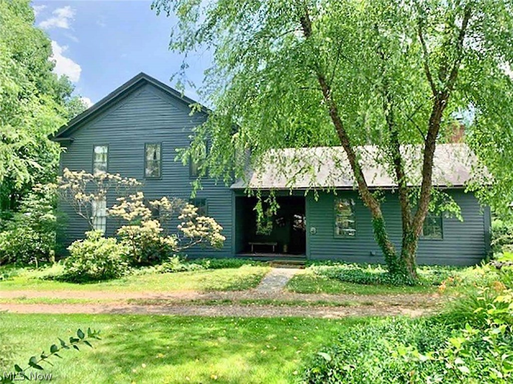 9+ acre country estate - Spacious 2 story home - Large double garage and workshop - Beautiful country setting