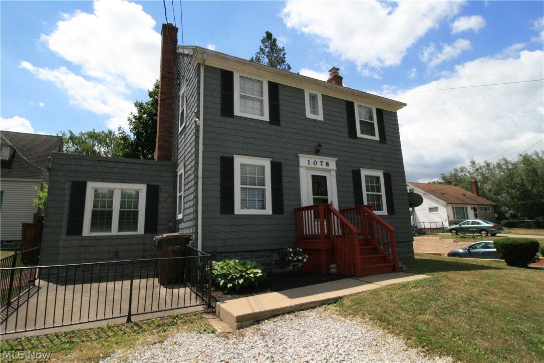 Opportunity is knocking - a steal at this price! This charming 50 foot lake front Portage Lakes home has public utilities! And 8ft+ ceilings in basement! Kitchen appliances stay and even washer and dryer! Partial finished basement has real hardwood flooring. Original woodwork is in excellent condition thru out, including floors. Attic has easy access for additional storage. 2nd story enclosed balcony provides water views and access to bonus room roof top. Formal dining room, updated baths, and an update kitchen with a big island providing you with enough space to cook and entertain without missing the fun! Step out on to the patio for a perfect summertime experience in your very own private, fully fenced in backyard. The owner is willing to leave his shed/man cave which has electric and cable. Gym equipment will stay if wanted. Original siding and windows. Set up a private showing before this home is gone!