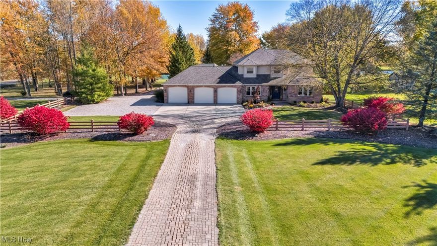 (Video Available) First Time Ever Offered – Very Special One-of-a-Kind Custom Country Estate! Rare opportunity to own this lightly lived-in, one-owner custom-built masterpiece, thoughtfully designed & cared for from day one. Situated on a breathtaking 3.58-ac treed lot w/¼-ac pond (elec), property offers privacy, functionality & beauty at every turn. Long paver drive w/split-rail fencing leads to the impressive 3-car front-load garage, architectural hip-roof design & partial stone front w/elegant coined edges that elevate its curb appeal. Second drive from side street provides access to a massive heated/cooled workshop w/three add’l 8-ft garage doors—ideal for contractors, collectors or hobbyists—offering 8+ total garage spaces. Enter through a leaded style-glass front door w/sidelights into a grand, light-filled foyer highlighted by a curved wood staircase. Spacious living rm features one of two gas fireplaces, separated from the formal dining rm by stately pillars and transom-window detail. French-doored 1st-flr den (attached to a full bath) offers flexibility as a possible guest or in-law suite. Chef’s kitchen is a showstopper w/walls of cabinetry incl pantry storage, ample counters w/breakfast-bar peninsula, gas range & stunning octagon-windowed dinette overlooking pond & private yard. Family rm w/2nd fireplace provides a cozy yet open gathering space for entertaining. Owner’s suite features a private balcony for morning sunrise, WIC, luxury bath w/tiled shower & bayed windows offering peaceful pond views. Add’l highlights incl 2 laundry rms (1 per flr), central vac, sec system, walk-up attic storage & secure rm in master that could serve as a panic rm. Built w/premium craftsmanship & materials, this home showcases pride of ownership throughout. Furnace 2023, dimensional roof 2022, no pets ever & move-in ready. Relax on the rear paver patio w/your morning coffee and experience the serenity of your private estate—truly one of a kind & not easily duplicated.