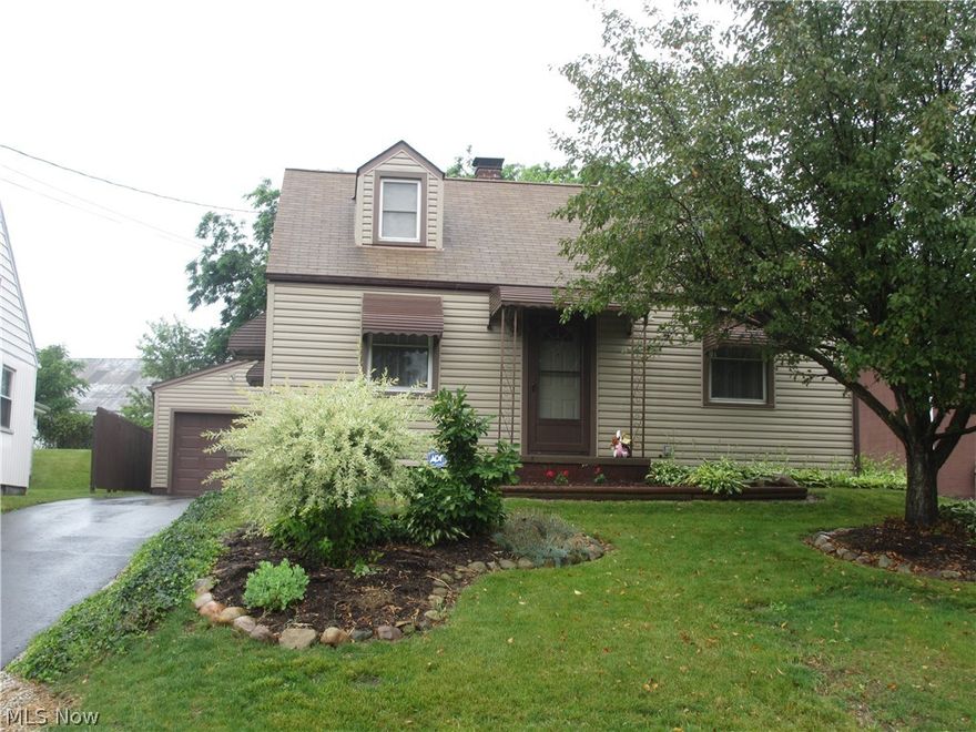 Charming vinyl sided Bungalow with hardwood flooring under carpet in Living Room and first floor Bedrooms.  Eat-in Kitchen with appliances, finished Lower Level and a large Workshop attached to Garage.  Covered Porch and nice partially fenced-in backyard.  New roof (2008), siding and vinyl windows (2002).  Furnace (2010) and hot water heater (2014).