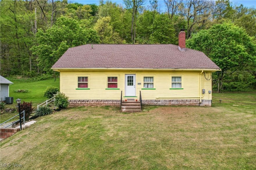 Escape to country living in this charming three bedroom raised ranch on 2.5 acres! Featuring a newly remodeled kitchen with stainless steel appliances and a convenient first-floor laundry with newer front-load washer and dryer. Relax in the spacious living room with a cozy wood-burning fireplace. Updated bathroom and two bedrooms complete the main level. The second floor offers a third bedroom and unfinished attic space with expansion potential. Enjoy peace of mind with many recent updates including a new furnace, A/C, water heater, flooring, electric panel, and septic system. Outside,  relax on the patio with a gazebo overlooking the fenced backyard, with some of the land being a wooded hillside. Roof approximately 2020. Basement is shared with vehicle parking.