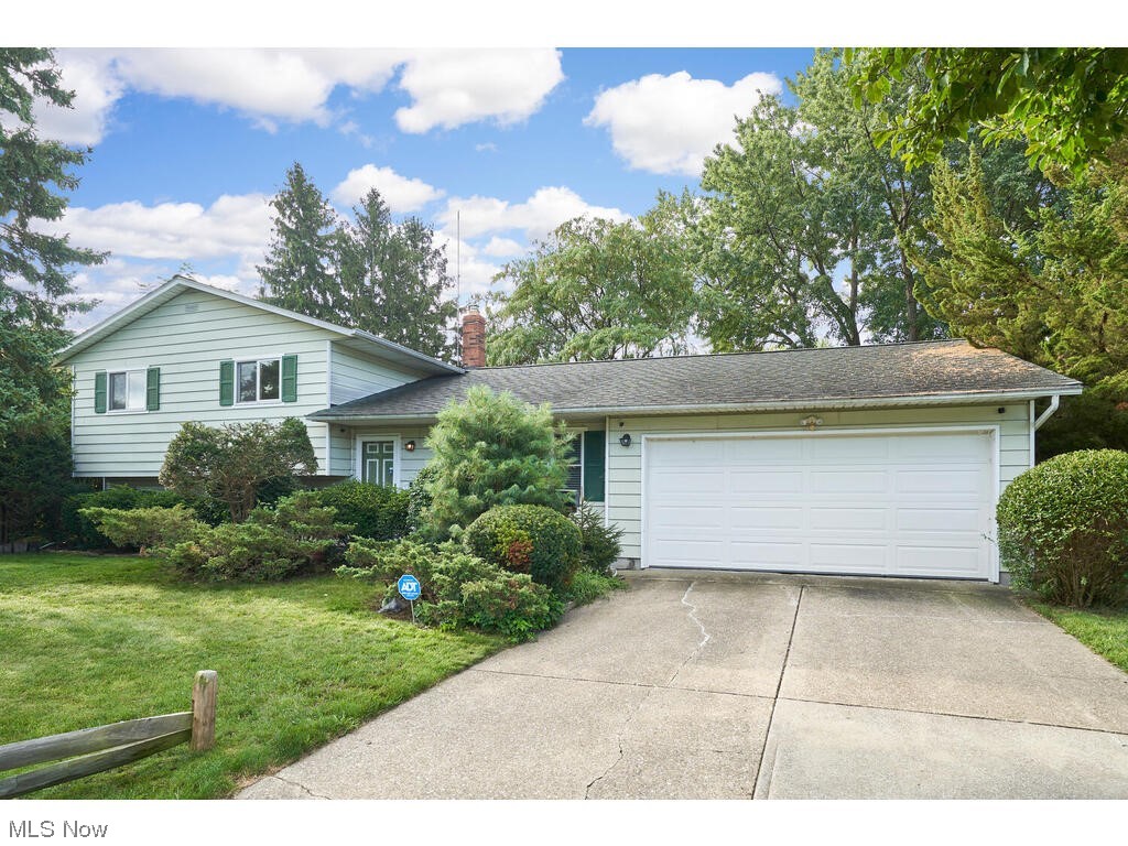 Mentor split level with 3 bedrooms, 2 full baths. Kitchen appliances and eat in kitchen with slider to the deck. Dining room, family room with fireplace, rec room addition with slider to deck. Hardwood flooring and 2 car attached garage. Add your updates and decorating touches.