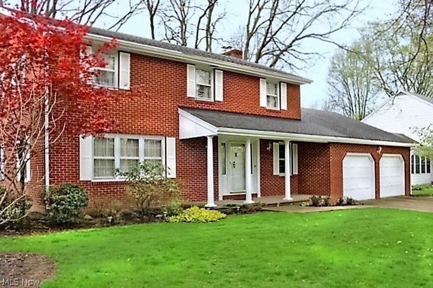 This home is a stately, red brick colonial with white pillars located on a beautiful street in one of the most sought after neighborhoods in Wooster. It has 5 bedrooms and 2 ½ bathrooms. The 5 bedrooms each are a good size and all have great hardwood flooring. The home has 6 panel solid wood doors. There is a large living room located next to a formal dining room. The large kitchen opens to the cozy family room that has a red brick fireplace with gas logs.  The family room door exits to a lovely screened-in porch with a door to the 2 car garage.  There is a rec room in the lower level.  The home comes with all appliances, plus a whole house generator!  There is a beautiful treed yard.  The backyard is very private.  If you like to golf, you are a half block from the Wooster Country Club. Move-in ready.  Note: Lower level waterproofing has been completed by Suttle Construction and the interior lower level walls have been painted.