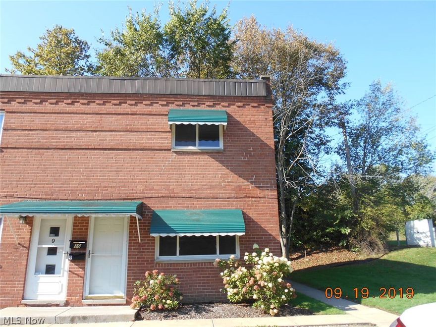 Available immediately. Rent INCLUDES water, sewage, and trash, snow removal. Tenant pays for gas and electric. Beautiful end unit town-home with fresh paint and brand new flooring. This 900 sq. ft. 2 BR/1 BA home boasts luxury wood vinyl plank flooring on the lower level and comes equipped with kitchen appliances. Small dogs OK for a non-refundable pet fee, no cats.  Location near schools, freeway, and shopping.  This unit is truly move in ready. All applications must be submitted for consideration by the owner. There is an application fee of $35.99 per adult for credit/criminal/prior evictions. The owner does not accept any voucher programs.