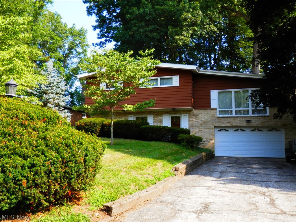 Nice 3 bedroom 2.5 bath split level in a desirable Munroe Falls neighborhood. This home has a beautiful wooded back yard that is perfect for family get togethers or relaxing in the hot summer. The upper level of the home has hardwood floors under the carpet, leaving the buyers an option when personalizing the home. This lovely home is priced right so the buyers can add their own personal touches. This house won't last long, schedule your showing soon.