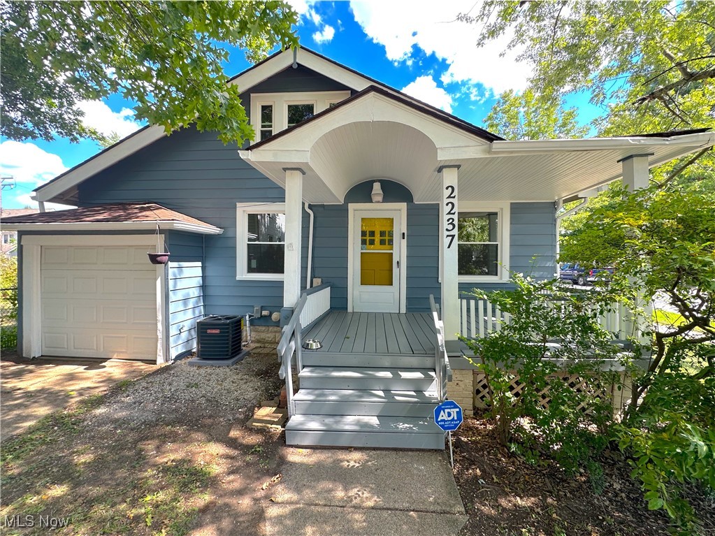 Welcome to Lakewood! This cozy home is conveniently located centrally, providing great access to all of Lakewood's fantastic amenities. Set back from the road behind a private tree line, enjoy the outdoors on the covered front porch. This home boasts a fresh paint job inside and out, as well as many other updates such as new tile and carpet. Newly installed windows and central AC will make sure that you stay cool on those hot summer days and warm in the winter. The driveway is conveniently located off of Delaware Ave and provides plenty of off street parking in addition to the attached garage.