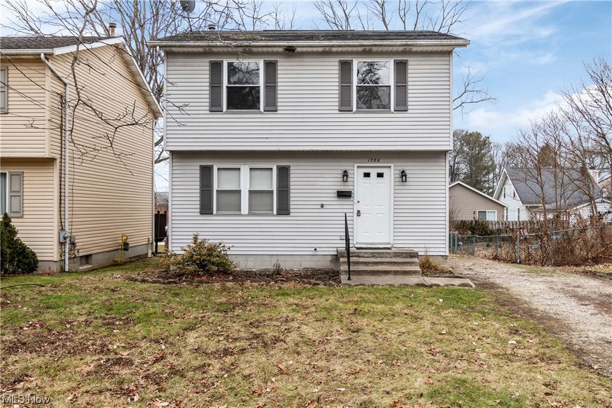 A move in ready colonial style home with many updates is now available in Firestone Park. The house is conveniently located just a half mile from shopping centers and restaurants. The whole house has been professionally painted, luxury vinyl flooring has been added in the entry, kitchen and both bathrooms. The kitchen is very bright with newly painted white cabinets and new hardware has been installed. The lighting has been updated in most rooms, including on the front porch.  The dining room is open to the kitchen and living room and there is lots of natural light.
Both bathrooms have new toilets and white vanities. The upstairs bedrooms have newer carpet and all the doors, trim and walls have been painted. You can access the upstairs bathroom from the main bedroom. GFI outlets have been added and 2 outside water spigots have been installed. The furnace was just installed in January 2024. The basement has a sump pump; floors have been freshly painted and new lighting has been installed. There is a spacious deck off of the kitchen and the flooring has been replaced. There is a good-sized backyard inclusive of a storage shed. The driveway has 7 tons of new gravel.