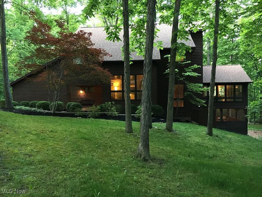 Love privacy and the view from the spacious living room with wall to wall windows and spa like master bath. The completely private back deck and hot tub is great for entertaining. Minutes form Zanesville but very secluded and quiet. 2 air conditioning units so upstairs always is cool. Surround sound in living room gives a theater like feel. 4 minutes from West Muskingum elementary, middle and high school. On a private dead end road with only 5 homes. Need to see to appreciate! 45 minutes from Columbus.