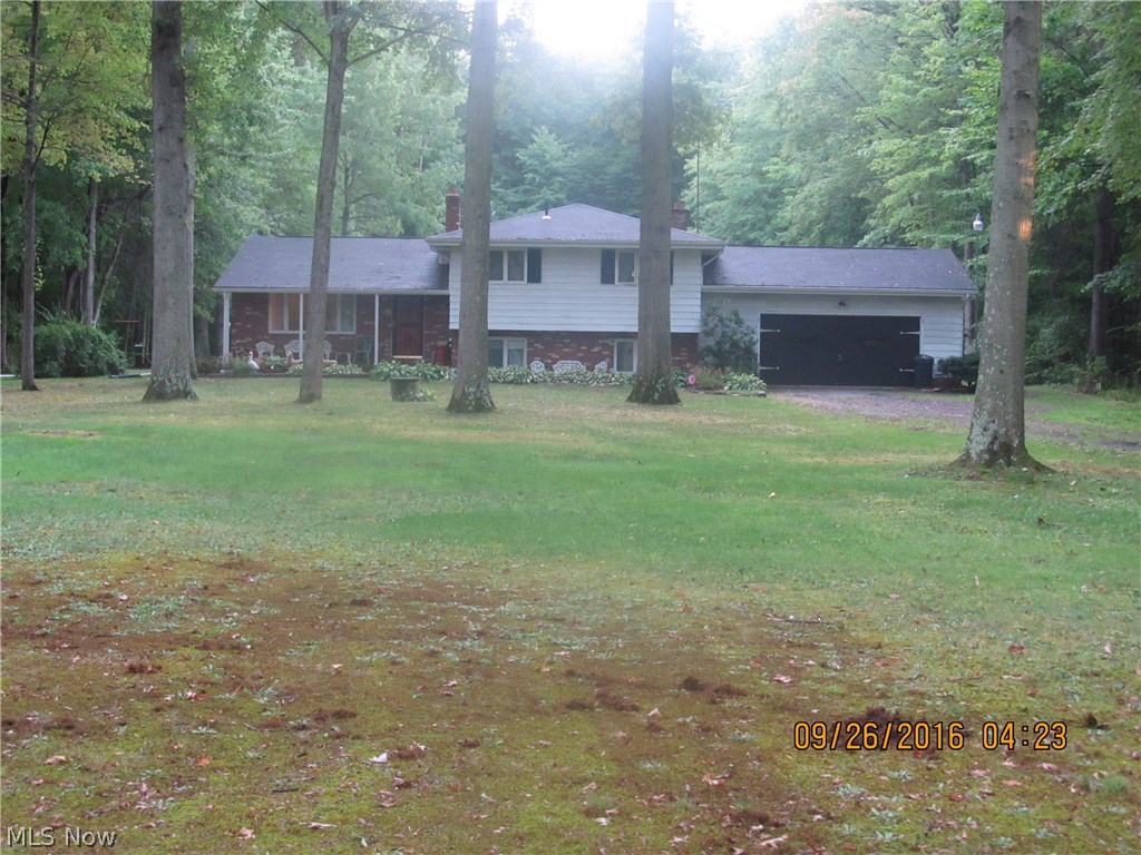 Super, well cared for one owner 4 level split-Howland School District. Home sits at end of deep driveway nestled behind some trees on 1.82 acres with privacy & wooded rear view. The home boasts 4 bedrooms with 2 full baths, a 2 car attached garage & rear 2 story barn/shed/outbuilding with a loft & lean to. Home has city water & city sewer is available at the street. The first floor has living room, eat-in kitchen, & dining room with an open view to family room with wood burning fireplace on the lower level. There is access from home to back patio, along with attached garage access to home & back yard. The large outbuilding has electric & a gas line for heat. There is tons of extra parking with a turn around behind the home. This house is priced to sell, it is solid & in great shape-the home just needs some cosmetic updates. Kitchen has double oven, refrigerator, & dishwasher-they are all newer & will stay.