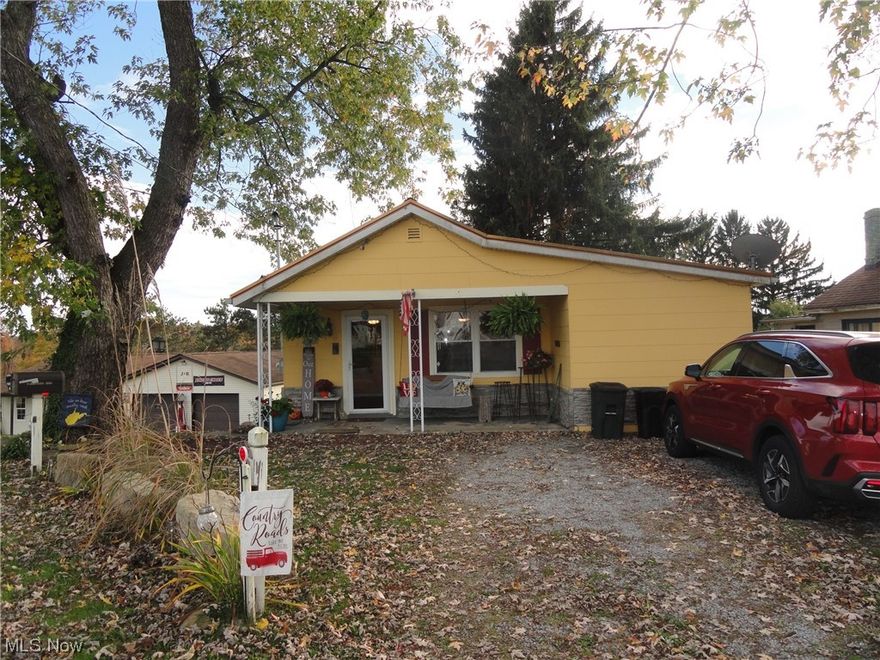 Very cute and comfortable ranch style bungalow in New Manchester.  Great kitchen, cozy living room, covered front porch.  3 bedrooms main level, very attractive decor.  Outside kitchen and patio areas make GREAT entertaining space.  Family room, bath and laundry lower level, plus lots of storage space.