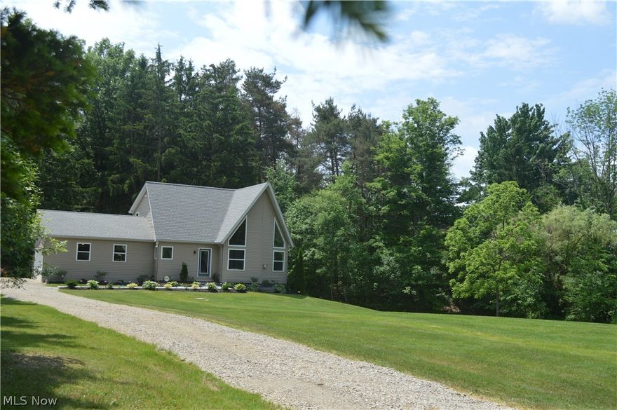 A complete remodel of a Modern Contemporary Two story, set on 3 acres, originally built in 1999. This 3 bed 2.5 bath home is quality w/exceptional design, combining comfort & style. It offers generous living space, the perfect setting to relax or entertain, indoors or out. The living room has a 17’ vaulted beamed ceiling, open to a loft, a gas fireplace, & an abundance of natural light throughout creates an open & airy space to the large open kitchen. Premium finishes in the kitchen include, new Kraftmaid cabinets, granite counters, apron sink, panel dishwasher, custom island w/quarts top & luxury vinyl floors. Dine in or on the deck directly off the kitchen. First floor owners suite w/custom barn door to bath, tiled shower w/soft close shower doors, vanity w/granite top, & walk in closet. Second floor offers 2 bedrooms, large closets, a bonus space, the main bath w/tiled tub, vanity w/granite & a loft overlooking the living room. The lower level offers a spacious family room w/a slidi