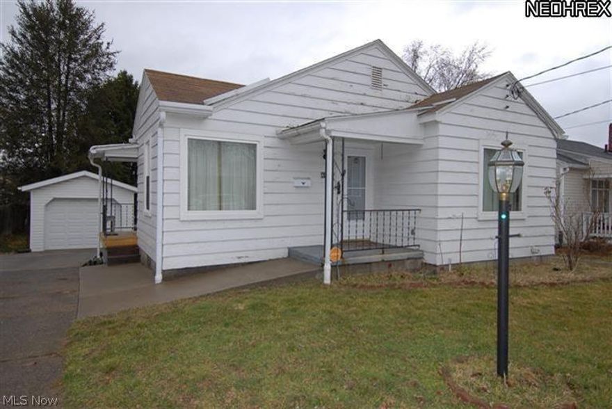 Pay less than rent! This nice 2 bedroom ranch has both a front & side porch. Newer detached garage w/cement drive & walkways including ramp to front door. Newer electric, furnace & A/C. Newer windows, doors & insulation. Bedrooms have lovely hardwood floors. Full basement has walkout to backyard. Backyard is fenced. Basement has 2nd shower & a large laundry area.