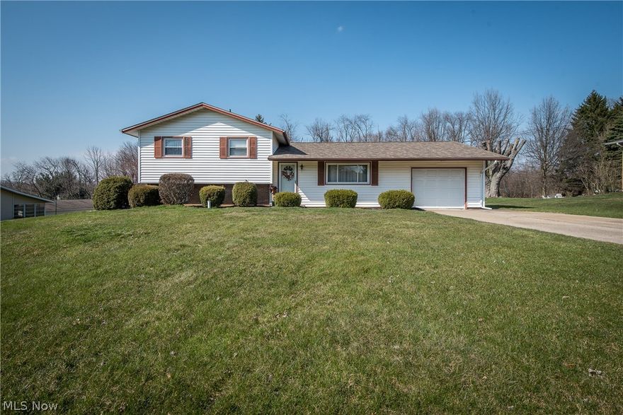 CANTON SOUTH SPLIT LEVEL ON HALF AN ACRE!  This family-friendly home is located in a nice neighborhood with easy highway access.  The split level floor plan features a main floor living room that opens to the dining room with bow window.  The nicely updated kitchen offers oak cabinetry, pantry and granite countertop with bar seating.  Rustic decor in the family room provides a warm and inviting gathering place with its wood planked ceiling, gas fireplace with brick surround and sliding door to the patio.  The nearby main bath has been improved with subway tile shower, pedestal sink, fixtures and tile floor.  The upper-level bedrooms are equally sized, two of which have hardwood floors and double closets.  The full bath that serves the bedrooms has also been updated with granite topped vanity, tile floor and soaker tub with tile shower surround.  A nice level backyard with stamped concrete patio backs up to a tree-lined 6 acres plus there's a 12 x 16 barn with garage and man door access