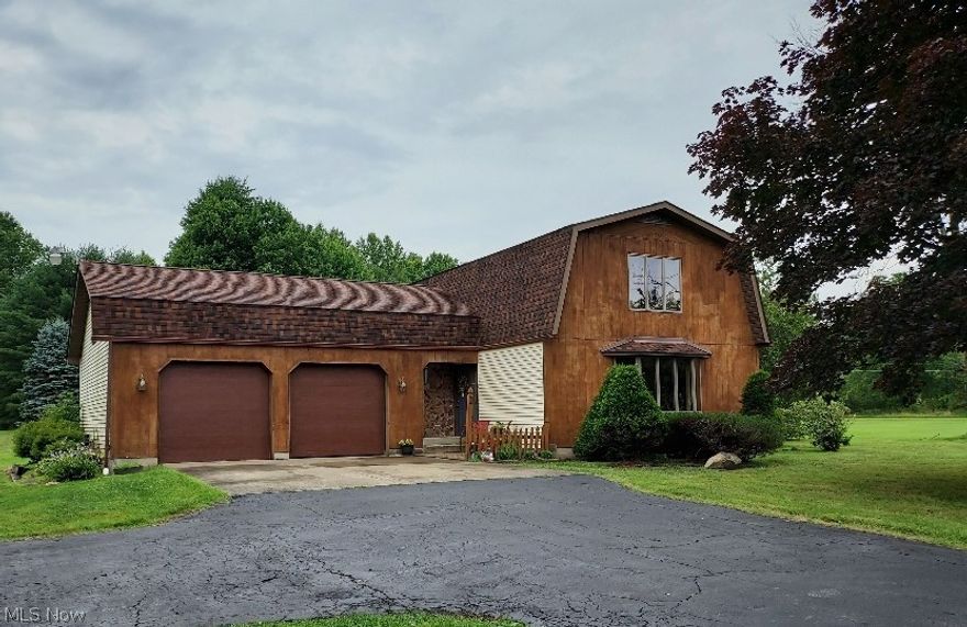 FABULOUS WOODED 12 ACRE LOT with unique 1 of a kind home. 24 x 38 barn with concrete floor, water and electric could be used for multiple purposes. The 3 bedroom cedar and vinyl sided home was built in 1985. It features a huge living room with large bay window. The dining room opens to the den and both have wide open views of the lot through the double sliding doors. Watch the deer from your back windows! All appliances, including the brand new refrigerator, stay in the galley kitchen. Grand sized master bedroom has a double closet. 2 more bedrooms and full bath on second floor. Currently the 3rd bedroom is being used as a laundry but can be removed with very minimal effort, if needed. 2nd laundry hook up is in the basement. Built in sweeper throughout the house and in the heated garage. The garage, which can fit up to 3 cars also has sliding doors along the back to take advantage of the views because the family often used it as a party room for their many gatherings. 14 x 24-foot covered pavilion for gatherings too, so much outdoor space to enjoy! Hubbard features great schools, community pool and great golf courses. There is also a campground and lake down the street.  Subject to seller finding home of their choice. Possession may need to be negotiated. Seller reduced price to allow for cosmetic updates and is providing a free 1 year home warranty.