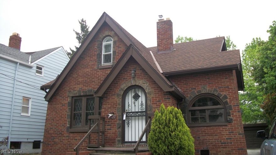 Brick bungalow with lots of character.  Beautiful window detail and curvy door ways. Spacious living room, formal dining room, two bedrooms on first floor and two bedrooms on second floor, partially finished basement with paneling and half bath in the basement. Two car garage.  Home has been freshly painted.