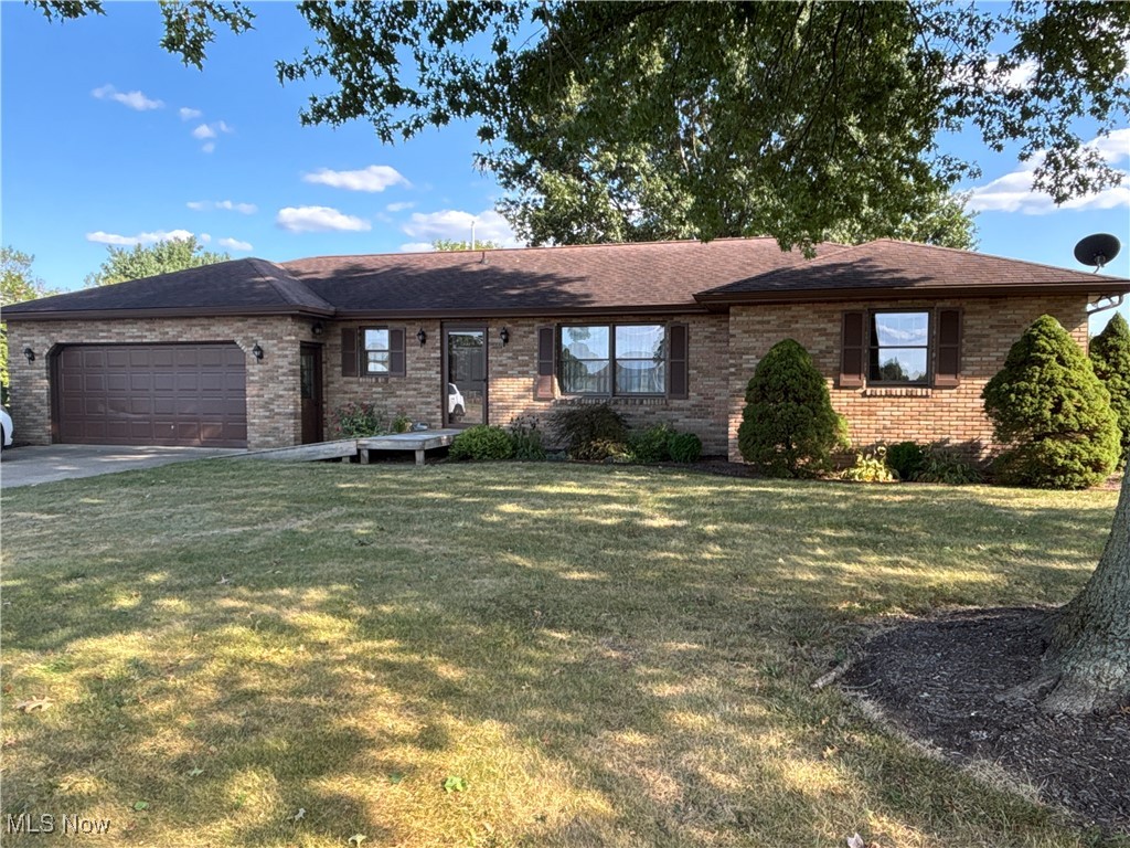 Welcome home to the country! Find peace and tranquility at this 2 bed 2 full bath home on a 1/2 ACRE +/- flat lot! This beautiful brick ranch is spotless and well cared for. One owner home built in 1989. It boasts 2 spacious bedrooms and two full bathrooms and laundry on the main floor! Talk about convenience!! Enter in the spacious living room that flows into the dining room and kitchen. The fully equipped kitchen has oak cabinetry and all appliances! Gaze out the kitchen and dining room windows into vast nature! Off the kitchen is a 4 season sunroom with abundant light and scenic views. Laundry room, complete with washer and dryer, are right off the kitchen for ease of use! This is also the second full bathroom and it includes a walk in shower! The lower level is a blank slate where you can create a number of ideas for additional living space! The attached oversize two stall garage has electric and water. Well manicured landscaping! Mature pin oak trees adorn the front and back yard. Two sheds for storage at the rear of the lot. Updates include: ac/furnace 2013, radon system 2012, hot water tank 2025, outside trim painted 2022. Home can be sold with .51 acre ($275,900) and the additional parcel,.51 acre, can be sold separately ($49,900). Ramp into front entrance.