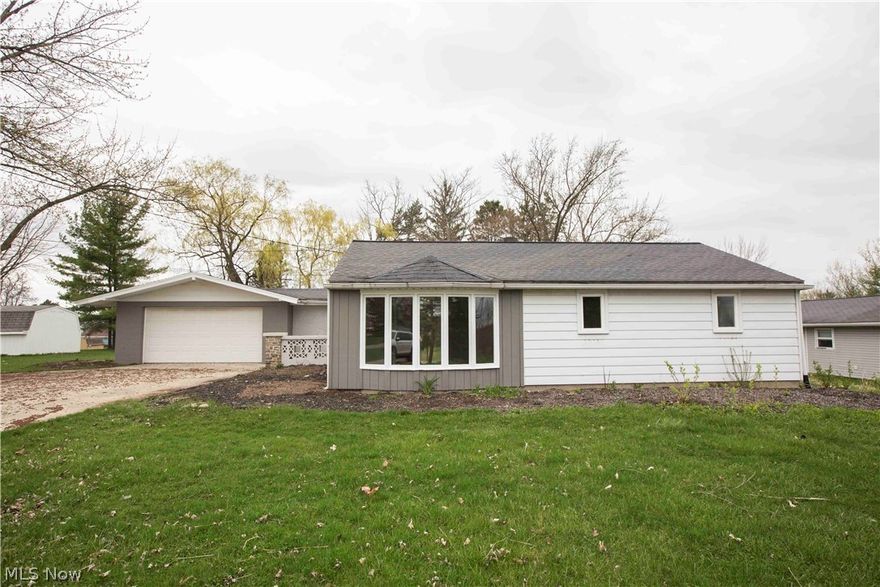 Welcome to this 3 bedroom  ranch! Feels like new construction! Home has been completely renovated! All new flooring, lighting, appliances, updated electrical, furnace, a/c and fixtures! Large family entry with built in storage. Massive Great room with cathedral ceilings and dual sliders that overlook the large grounds. 3 large bedrooms w/ Master having 3 closets. Kitchen has subway tile backsplash, granite and stainless appliances. Living room with bay window. First Floor laundry. Tiled bathroom shower. Oversized 2 car garage! Home sits on a private partially fenced lot! Minutes from Expressways! Home warranty included.  Agent owned.