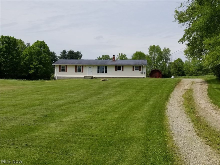 Country living with all the perks.  This freshly renovated home has new flooring, windows, finished basement, remodeled bathrooms, and deck.  The home is located on a picturesque 1.85 acres with plenty of yard front and back.  A large deck with 2 levels one with new wood planks and the other is pavers allows for a large area to entertain and enjoy the view.  The large finished basement allows for endless opportunities.