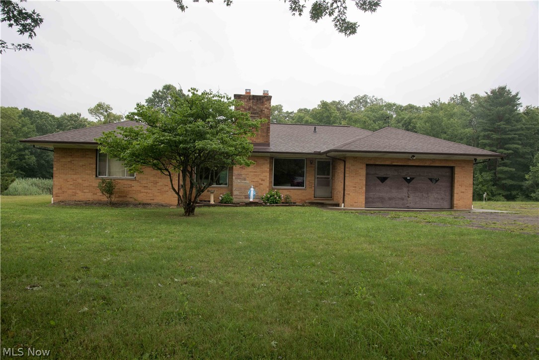 This all brick ranch home with 3 bedrooms and one and a half baths is set deep into the yard for privacy. A tranquil setting with easy access to shopping, dining and highways. Beautiful hardwood floors in the bedrooms plus oak, pegged flooring in the living room and dining room. Generous living room with large picture windows and a wood burning fireplace. Dining room with built-in china cabinet leads to the original kitchen with plenty of space for your fresh kitchen design ideas, a newer wall oven is already in place. A spacious first floor laundry room is located just off the kitchen with access to the backyard - could be a great mud room/pool room. A full basement with a wood burning fireplace and a built-in bar offers additional entertaining space. A screened porch leads you to your large concrete patio and your in-ground pool. All pool equipment will stay. With over 3 acres of land (2.87 acres plus a second parcel with .36 acres), you will have plenty of room for gardens, play-set