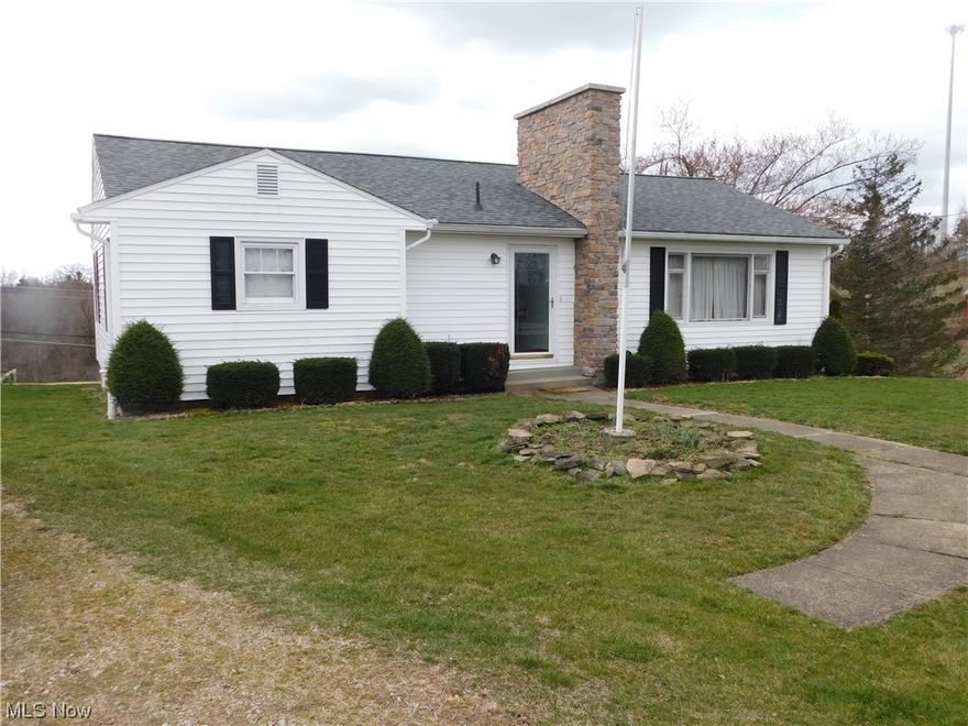 Super nice ranch home that has been loving cared for. Vinyl front door really sets this home off. The vinyl siding and the stone chimney are very attractive. This all sits on over one half acre. (survey being completed) A two car detached garage with electric garage door openers and electric in the garage.
Newer large family room 17' X 18' with large windows letting in the sun light and letting you look out at the country side. The door that leads out to the deck.  Living room has a decorative stone fire place. There is hardwood floors under the carpet in all the rooms but the newer family room. Windows have been replaced, wood trim and window sills are oak. 
Kitchen cabinets have been replaced with attractive counter tops. There are many cabinets in this kitchen. Quality cabinets. Check out the drawers. They are dove tailed. The eat in kitchen is large and can accommodate large gathering. 
There are three bedrooms. However one has a new washer and dryer. They stay with the house. T