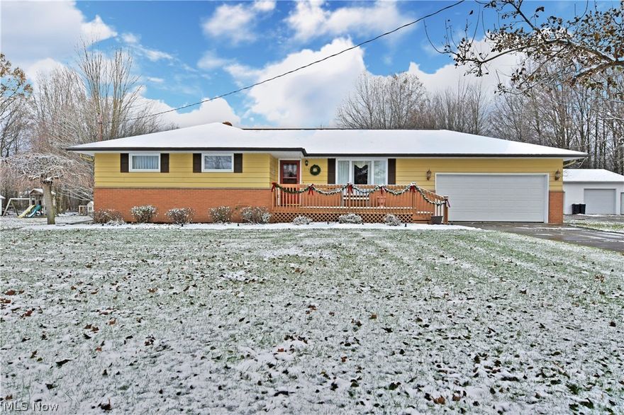 This beautiful well cared for ranch home has everything you’ve been looking for! A deep-set lot includes a spacious back yard featuring a personal greenhouse. The exterior benefits from an oversized front porch, perfect for those summer days and 2 car attached garage. Inside, rich colored walls and lush cream carpets greet you at the door, as the living room is filled with natural light from the large front windows. Bed and bath access branches off down a short hallway while you make your way towards the kitchen. Built in cabinets make for a great display area for dishes or décor. The updated eat-in kitchen design houses the dining room table beneath a dropped lighting fixture, while an array of stained wood cabinets and Corian counters wrap the kitchen as the sliding glass doors provide nearby entry to a stunning family room. Here, rustic wood panel walls encompass a cobblestone mantle with instant gas fireplace. Exposed truss work above creates a rich look while paired with the reces