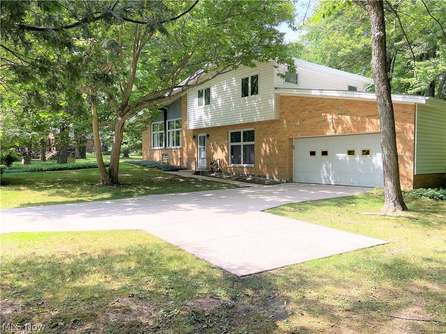 This Spacious Split level home sets on a 1.4 Acre treed lot! As you enter the home, the Foyer level leads you to the Living Rm, a full Bath, and Bonus Rm with access to the two-car garage.  Step up to the Great Room with gas Fireplace and a wall of windows for lots of natural light. This area includes an open concept Dining Rm space and Kitchen, including all appliances. Step down to another Bonus space leading to the cozy Family Room with wood burning stove and access to the enclosed Sun Porch, a great place to relax and enjoy nature. Three nice sized Bedrooms plus a Full Bath complete the upper level. The backyard provides plenty of open space plus mature trees, and a shed at the back of property. This home has a nice setback, with additional parking or turnaround area.  Basement includes a rec-room area, plus unfinished storage side with Laundry area, which includes the newer Washer and Dryer.  Rheem Furnace (2014). Trane A/C (2017). Hot Water Tank (2015). Roof (2011/2001). Basement