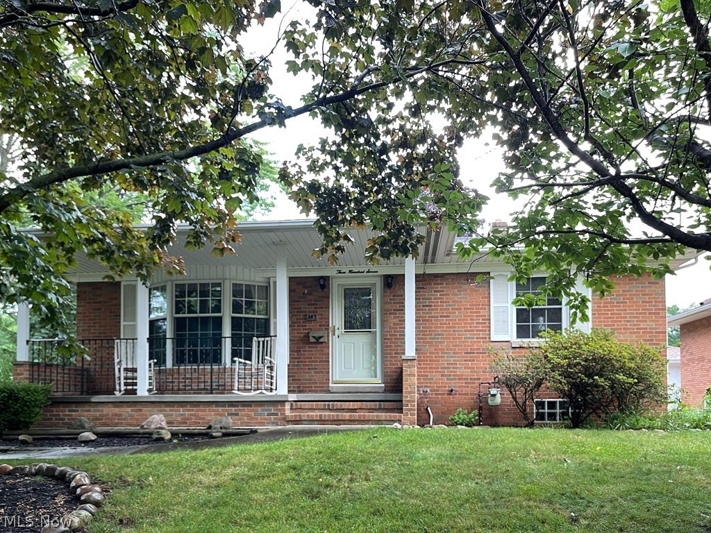 Rarely do you run across a truly special home like this one. Move-in ready and located in one of Cuyahoga Falls's great neighborhoods, this all-brick, 3-bedroom, 2 full bath ranch home has been home to the same family for over 50 years! With room for everyone, the family enjoyed many years here. Your first impression will be welcoming. The living room has plenty of natural light, new carpet and will hold multiple couches and chairs for seating. The eat-in kitchen features loads of cabinets, including double, built-in Lazy Susan’s! It will be great for storing dishes or extra pantry food items. All bedrooms are located on the main, and have expertly-refinished hardwood floors. The lower level rec room is one of the nicest you’ll see. It will be great for family time. There's a bonus room that could easily be a 4th bedroom too, an additional full bath that has both a stand up shower AND tub, and a workshop! If you've been hoping for a house with a nice view, this property sits right ac