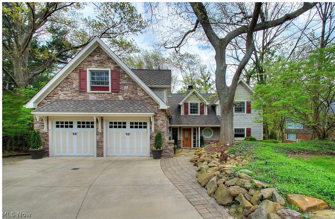 This incredibly charming home nestled in a spectacular & private wooded setting, is located in one of Rocky River's most prestigious neighborhoods with close proximity to Westwood Country Club! It has been completely rebuilt from top-to-bottom with the finest quality and details. Offering 4,000 sq ft of living space, 4 large bedrooms (all with their own bathrooms), 5 total baths, and custom decor and amenities throughout - This home is truly one-of-a kind! The first floor offers a welcoming foyer, elegant kitchen with gorgeous granite, large island, walk-in pantry, stainless steel appliances, & solid wood cabinetry. You'll find abundant natural light in the dining and living room, complete with gas fireplace, and a convenient laundry/mudroom & elegant powder room located off the 2 car, heated garage. Upstairs are 3 large bedrooms with private baths - including a master suite with private balcony, luxurious bath with rain-head shower & walk-in closet. The amazing walk-out lower level ha