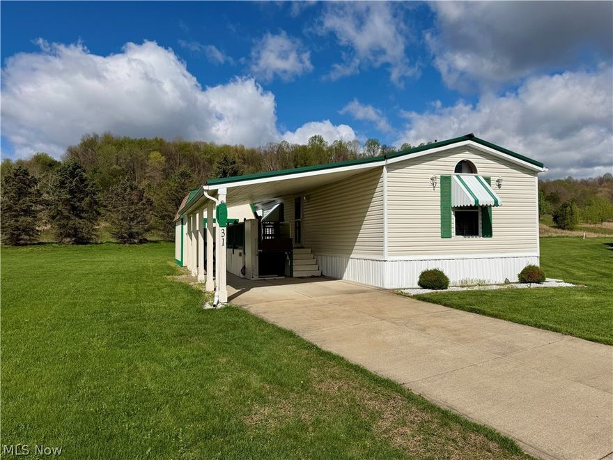 Mobile home only, Woodale Retirement Village - Located on LOT 31. The lot rent is $290 monthly. 2000 Mansion single wide manufactured home. 1,140 sq. ft. Featuring 3 bedrooms, 2 full baths, updated kitchen and laundry area with new washer and dryer. New gas FA furnace. Central air. Nicely maintained with large covered carport parking. Storage shed and Bruno mobility vertical platform lift included. Good steel roof. Public utilities. Tax reflects “mobile home” tax. Transfers by title. Super quiet and nice neighborhood. Just west of Minerva.