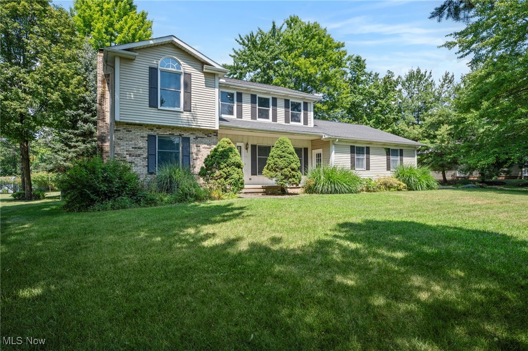 Welcome to this spacious 4 bedroom, 2.5 bath colonial boasting 2,104 sq ft of living space, a partially finished basement, and a fantastic fenced backyard in a desirable neighborhood. Inside, you’ll find a bright, inviting layout with brand new carpeting throughout. The main level features a warm and rustic kitchen with rich wood cabinetry, granite countertops, stainless steel appliances, a large breakfast bar, and a charming window seat overlooking the backyard, flowing seamlessly into the dining and living areas—perfect for entertaining. The family room offers a brick fireplace with built-ins and sliding doors to the expansive deck, while a front living room provides even more gathering space. A stylishly updated half bath and a first-floor laundry room with utility sink add everyday convenience. Upstairs, the primary suite features vaulted ceilings, a dramatic accent wall, and a private bath, while three additional bedrooms—two with unique design touches like shiplap walls or updated flooring—share a full hall bath. The lower level offers a large partially finished rec room plus a utility/storage area, giving you plenty of space to expand. Outside, the fenced backyard is a dream with mature trees, a spacious deck, and a storage shed—perfect for gardening, play, or outdoor entertaining. Updates and extras include new carpeting throughout, newer windows in key areas, stylish fixtures, ample storage, and an oversized lot that offers both privacy and room to play, all just minutes from schools, parks, and shopping.