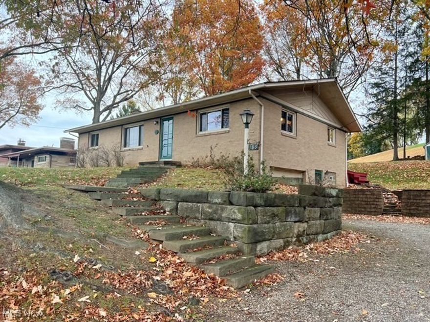 Welcome to this beautiful brick raised ranch perfectly located just steps from Tuscora Park. This home has 3 bedrooms, 2 baths, and a tandem 2-car garage. It is situated on a great 95x150 lot. The main level has a bright living room, a well-equipped kitchen that includes all of the appliances, and a spacious dining room with pocket doors. There are also 3 nice size bedrooms and a full bath. The lower level provides even more living space with a family room, possible 4th bedroom, and the second full bath. Outside is a large back deck perfect to watch the fireworks from, a storage shed and a playhouse. The backyard is nice and private with mature trees. Act now and get immediate possession at closing.