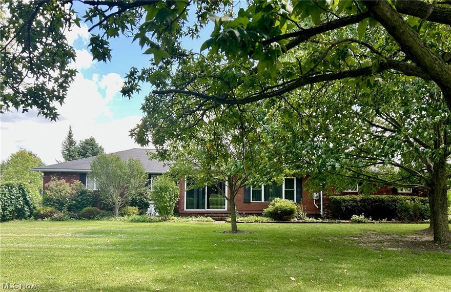 Don’t miss your chance to own this well-maintained brick ranch with tons of inviting living space located in the sought-after Keystone School District.  The main floor features a spacious family room with a brick accent wall and fireplace, large kitchen with newer appliances and eat-in space, and a separate dining room and living room. In addition you will find an enclosed front porch, 3 comfortably-sized bedrooms and 2 full baths. The partially finished dry basement with a woodburner adds even more relaxing  living space for the family to gather, and includes several additional finished rooms to use as work from home space,  guest bedrooms or storage areas. At the rear of the house the bright  4-season room opens to a deck overlooking garden beds with mature plantings, rows of apple and pear trees, and two lush acres bounded by a small creek. The attached 2 -car garage has ramped access to the mudroom/laundry room. A separate 1,280 square foot outbuilding with electricity functions as